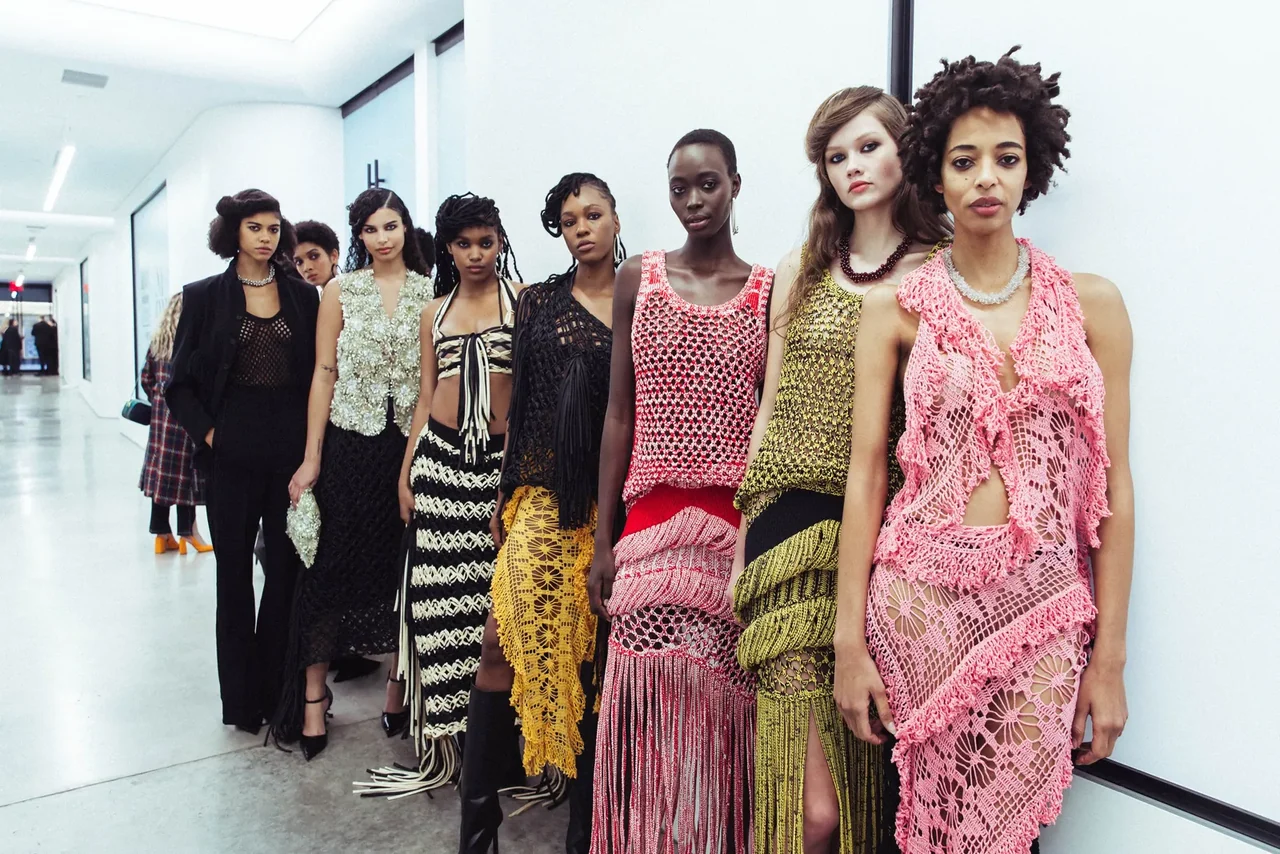 Diotima — A line of models in intricately textured garments