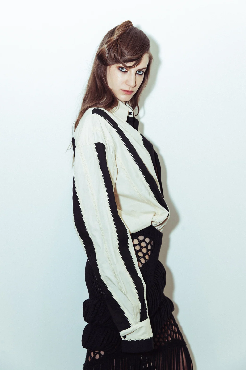 Diotima — Portrait in a graphic striped cardigan