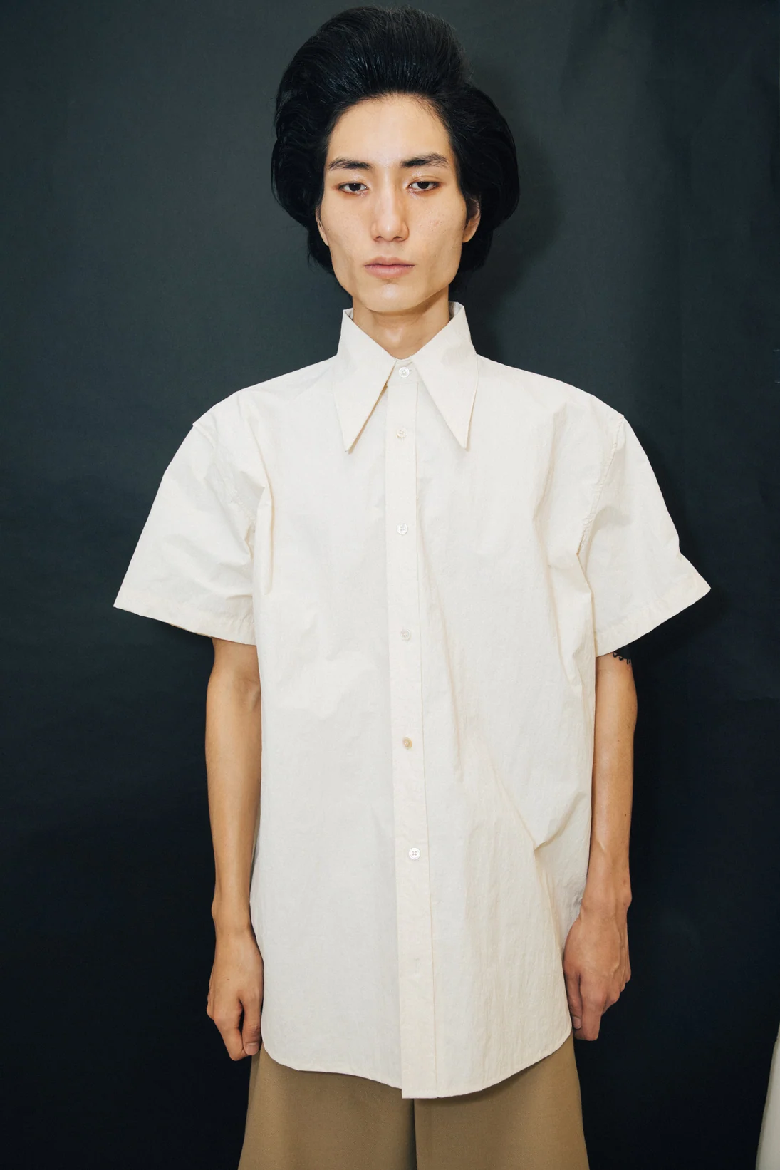 Willy Chavarria — A model in a crisp short-sleeved shirt