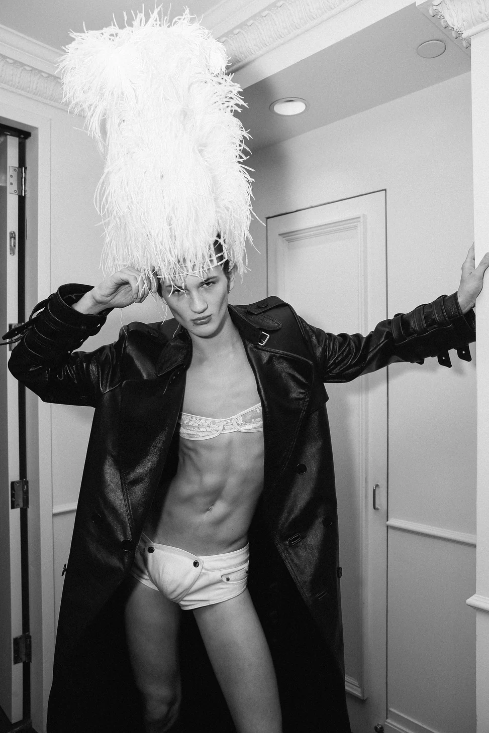 Palomo Spain — A model with a dramatic feather headdress