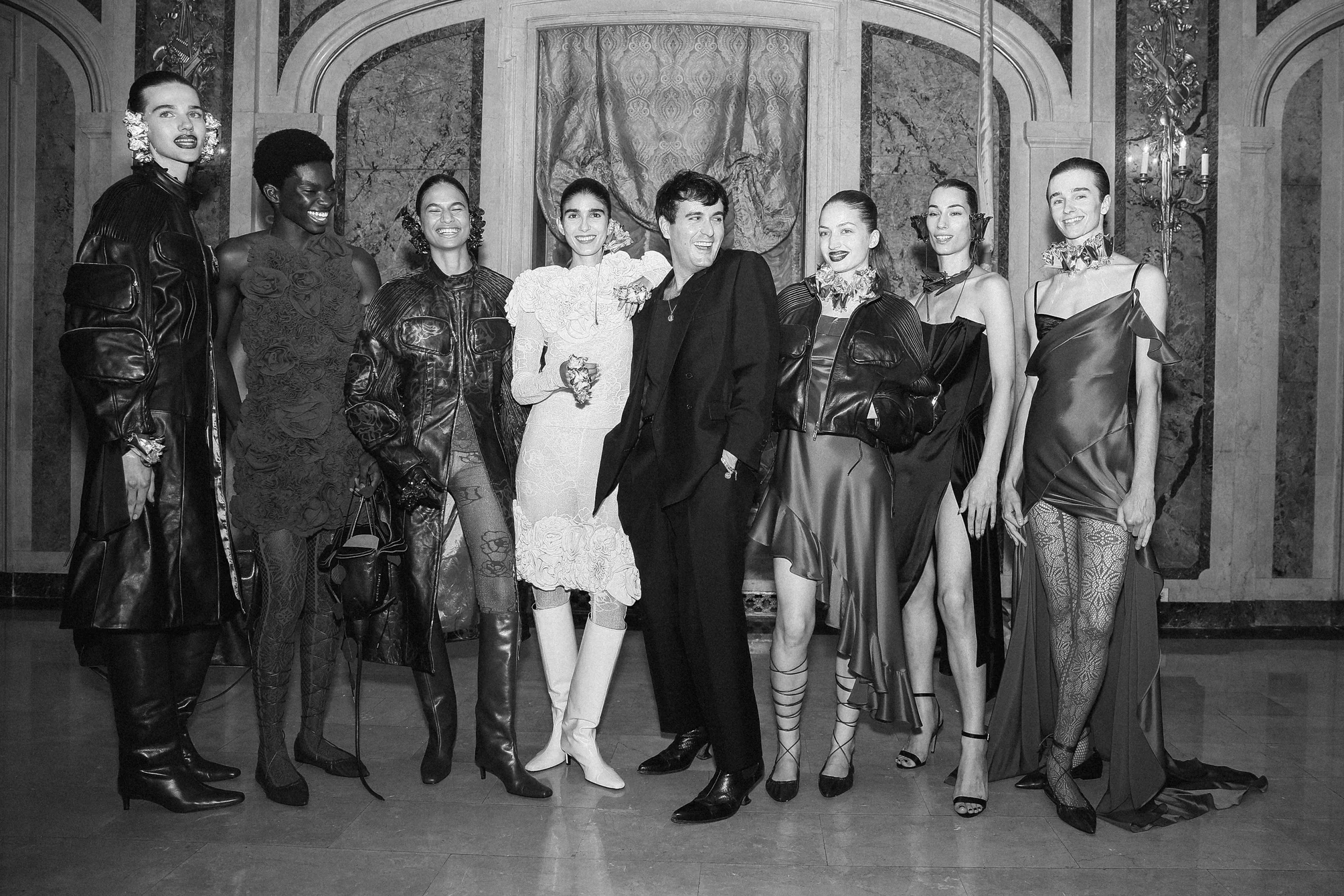 Palomo Spain — A group of models in an ornate interior