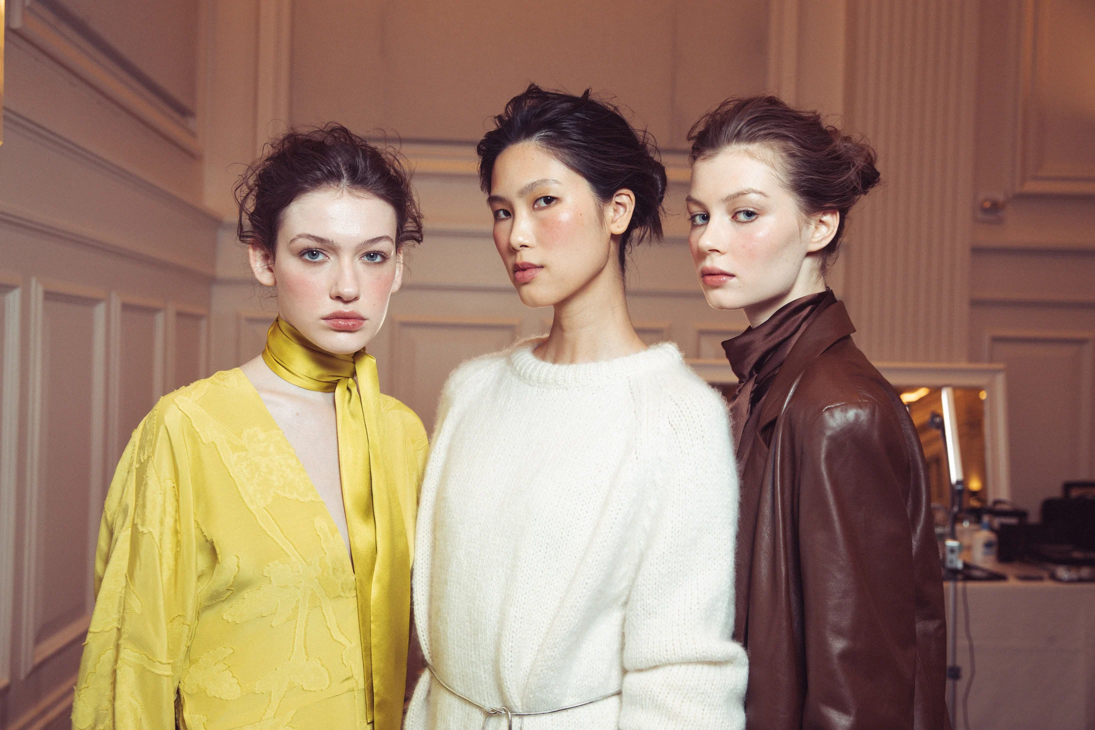 Alejandra Alonso Rojas — Three models waiting backstage