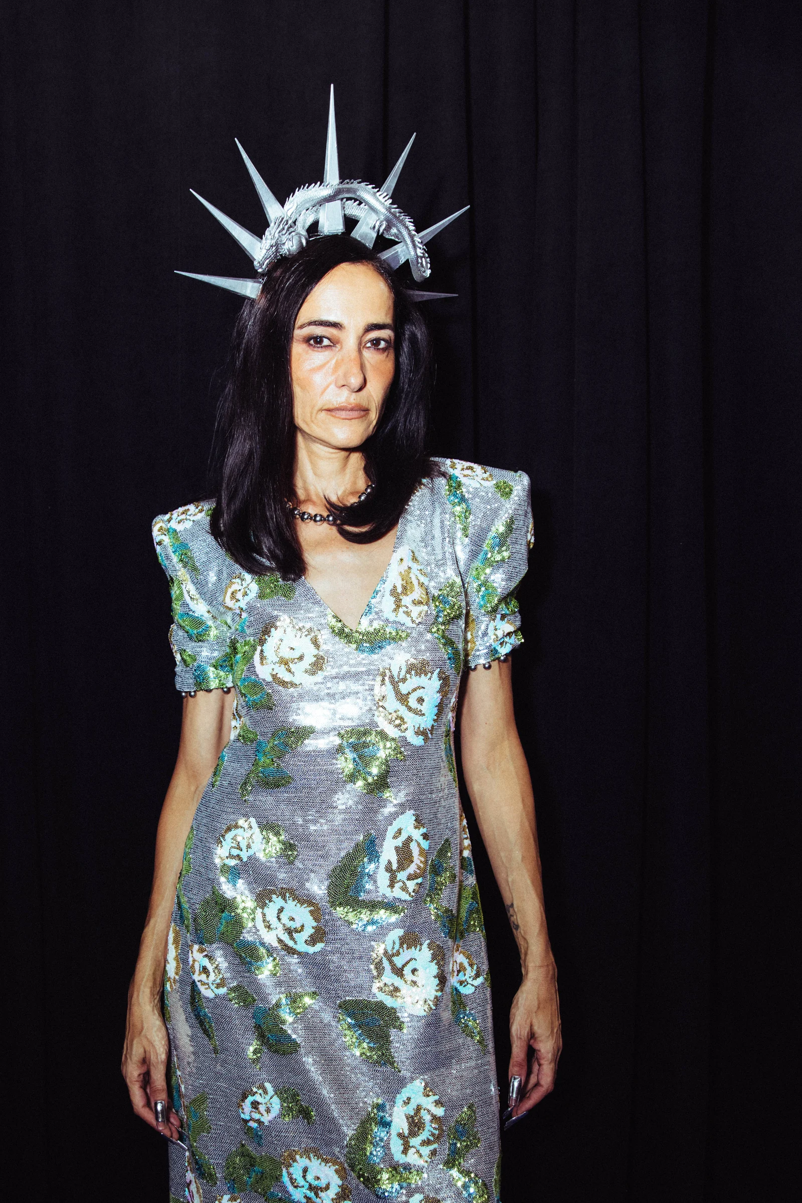 Private Policy — Portrait of a model in a floral dress with a spiked headpiece